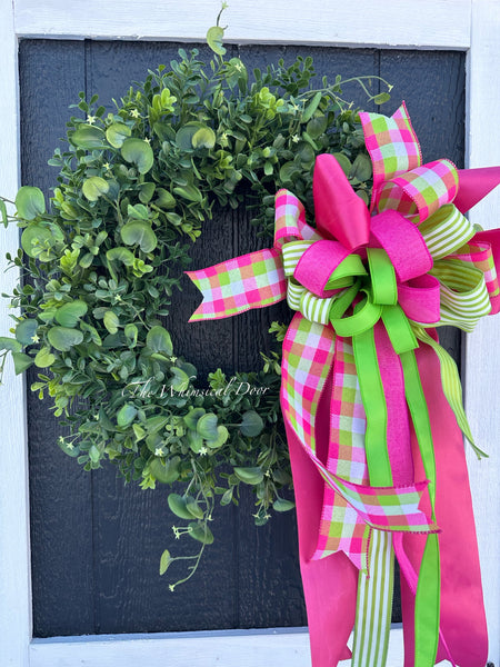 Boxwood wreath with oversized bow